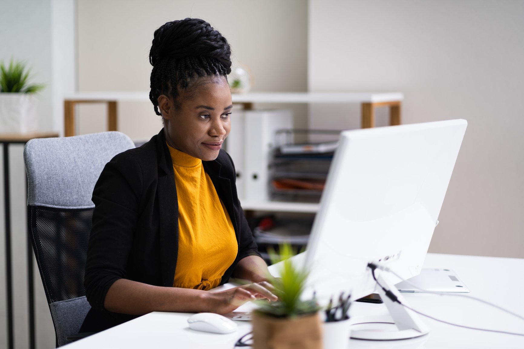 Happy Professional Woman Employee Using Computer